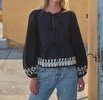 embroidered peplum blouse in black