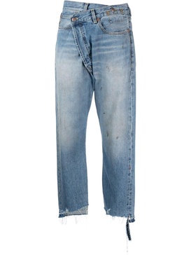 off-centre distressed denim trousers