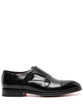 double-buckled patent-leather shoes