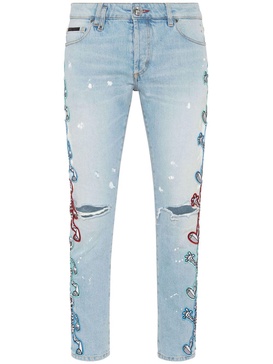 Skully Gang low-rise skinny jeans