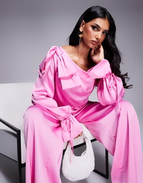 ASOS LUXE satin off the shoulder wide leg jumpsuit with bow in pink