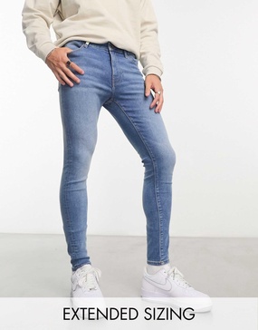 ASOS DESIGN power stretch jeans in mid wash