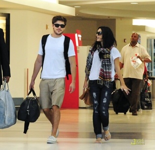 Vanessa Hudgens at LAX Airport with Zac Efron 19 August