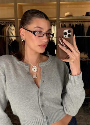 black glasses and gray cardigan sweater?