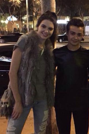 Kendall Jenner with a Fan August 1, 2015