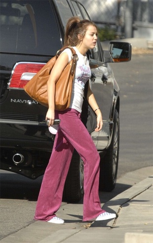 Miley Cyrus at Airport Boarding Private Jet March 8, 2008