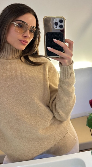 beige pants, sweater, and glasses?