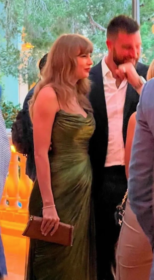 green gown and gold clutch handbag?