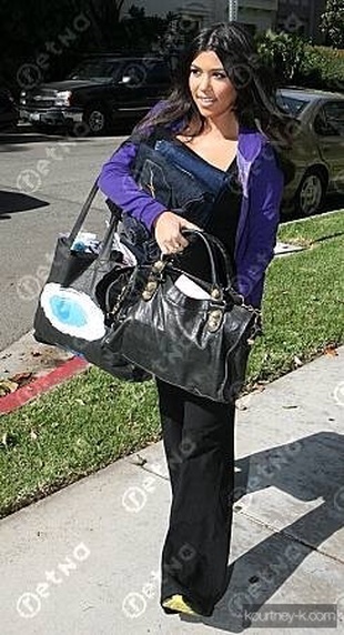 Kourtney Kardashian Getting Into Car with Shopping Bags October 29, 2009