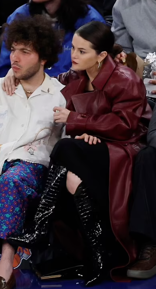 red leather coat, black boots, gold hoop jewelry, and handbag?