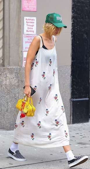 white floral dress, sneakers, and yellow quilted handbag?