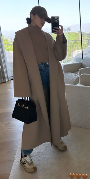 beige coat, sneakers, blue jeans, and black handbag?