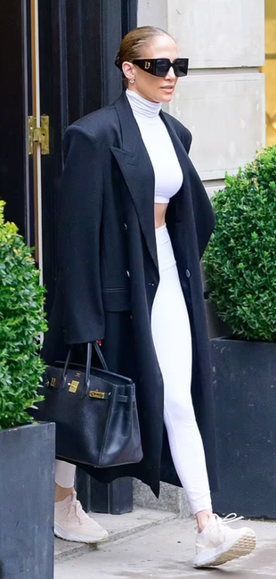 black coat, sneakers, tote handbag, and sunglasses?