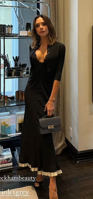 black pleated dress, cardigan, shoes, and handbag?