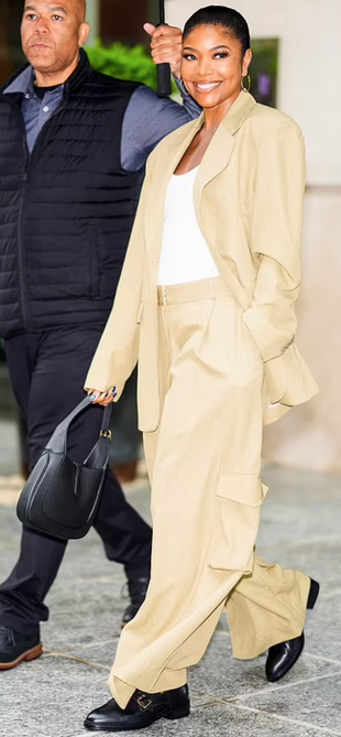 black handbag, beige pants, and blazer?