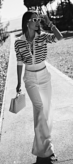 white sunglasses, woven handbag, and lace up striped sweater?