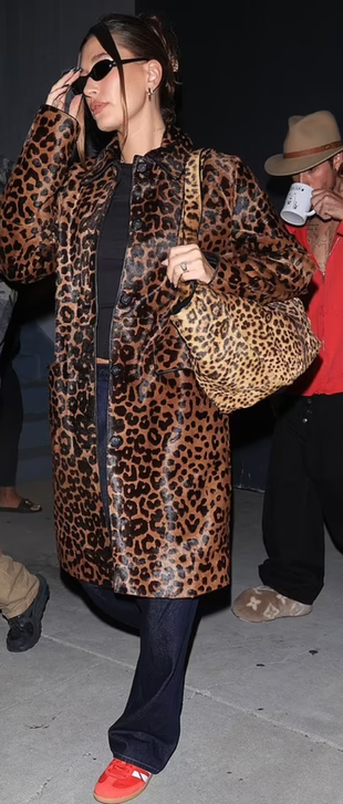 leopard coat, handbag, black sunglasses, red sneakers, and jewelry?