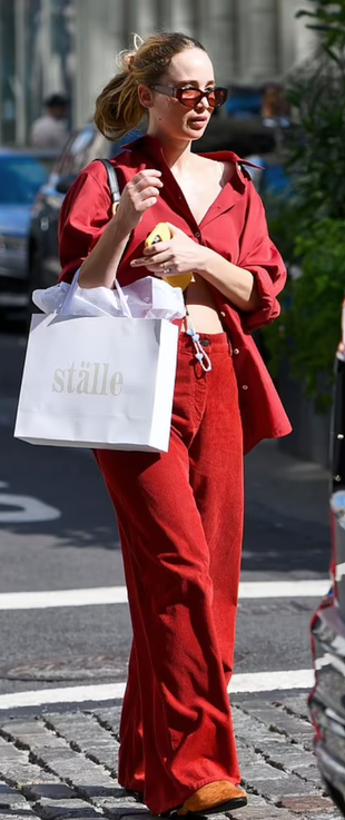 red shirt, pants, black handbag, shoes, and sunglasses?