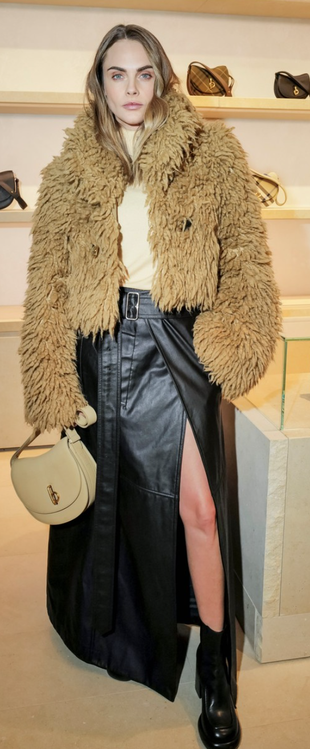 black boots, maxi skirt, beige jacket, and tan handbag?