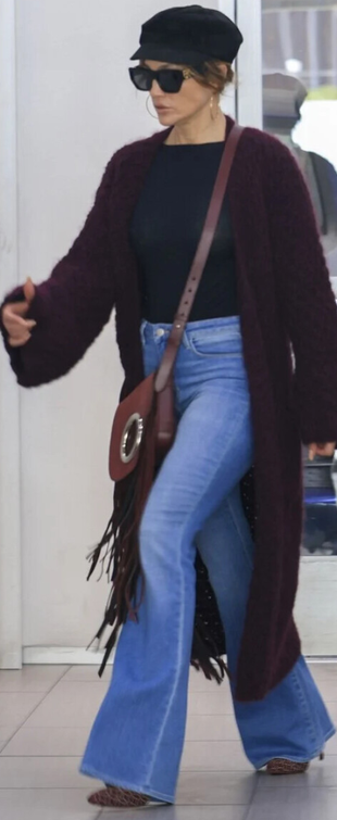 blue jeans, black hat, jeans, boots, and fringe handbag?