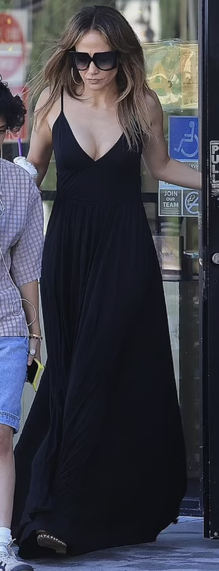 black sunglasses, maxi dress, gold jewelry, sandals, and handbag?