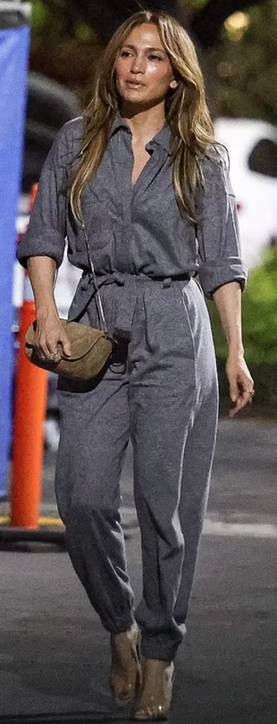 gray jumpsuit, clear sandals, and beige handbag?