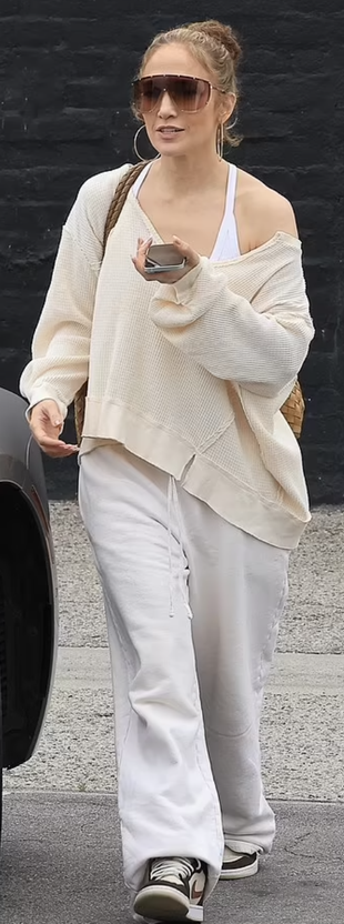 gold hoop jewelry, beige sweatshirt, and sneakers?