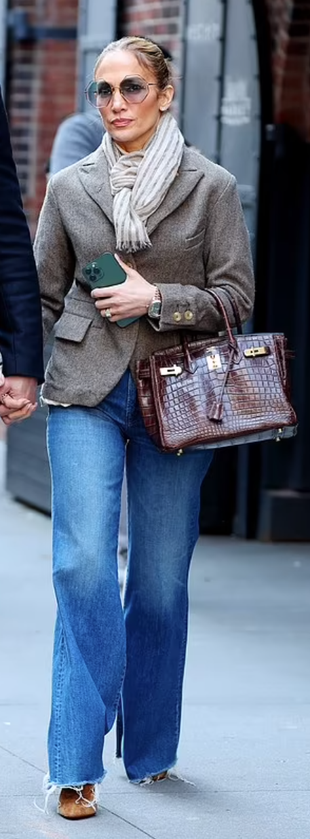 beige jacket, blue jeans platform tan shoes, brown tote handbag, and sunglasses?