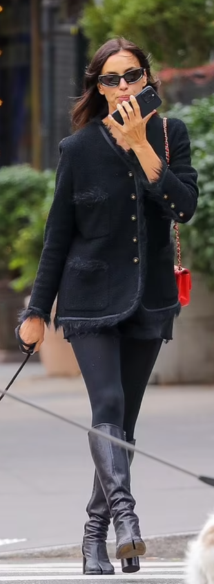 black jacket, red quilted handbag, and boots?