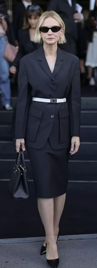 black sunglasses, belted jacket, skirt, bag, and pumps?