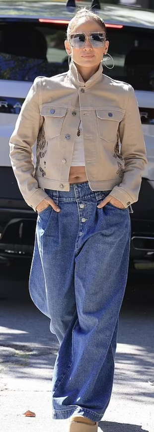 hoops jewelry, blue pleated jeans, and platform beige boots?