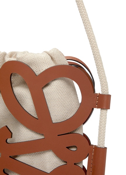 Anagram cut-out crossbody in classic calfskin and canvas