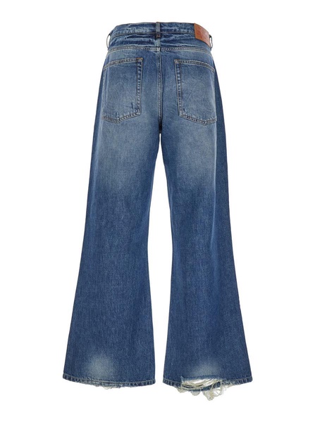 Blue Flared Jeans With Logo Patch On The Rear In Denim Man