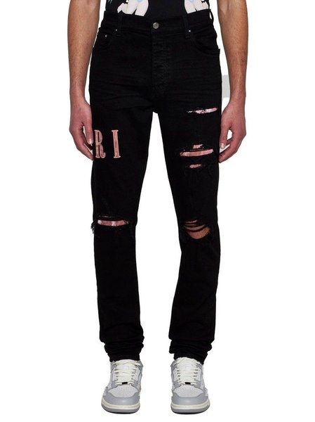 Amiri Logo Patch Distressed Skinny Jeans