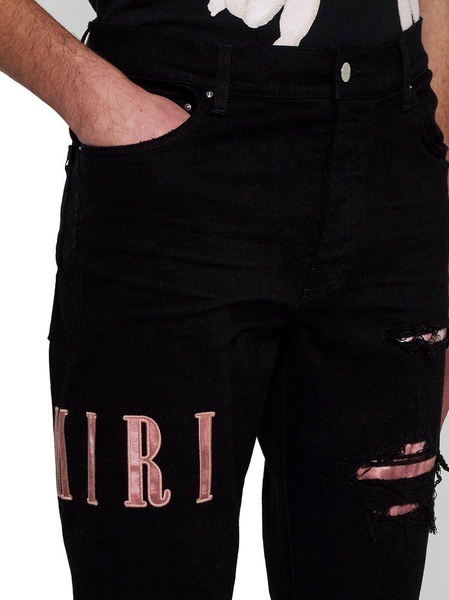 Amiri Logo Patch Distressed Skinny Jeans