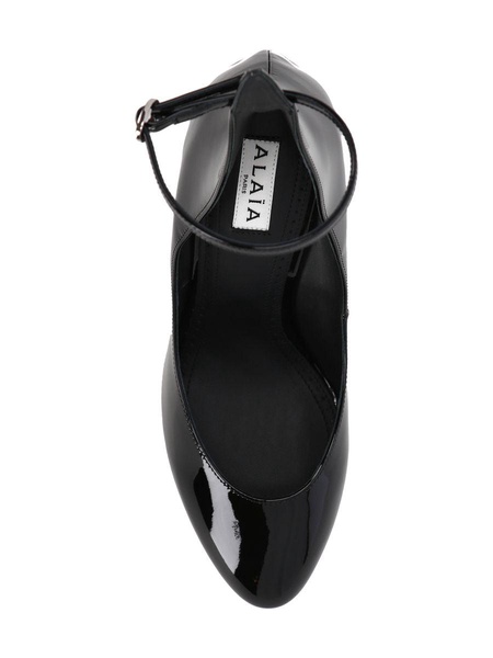 Ankle-buckle patent-leather heeled courts