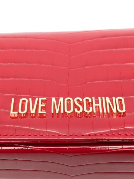 Red crocodile-embossed synthetic leather clutch