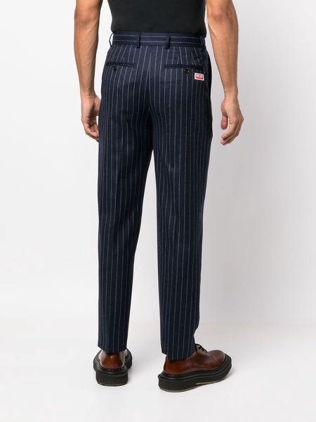 tapered pinstripe-print trousers