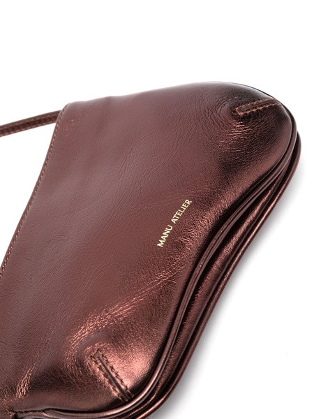 Curved metallic shoulder bag