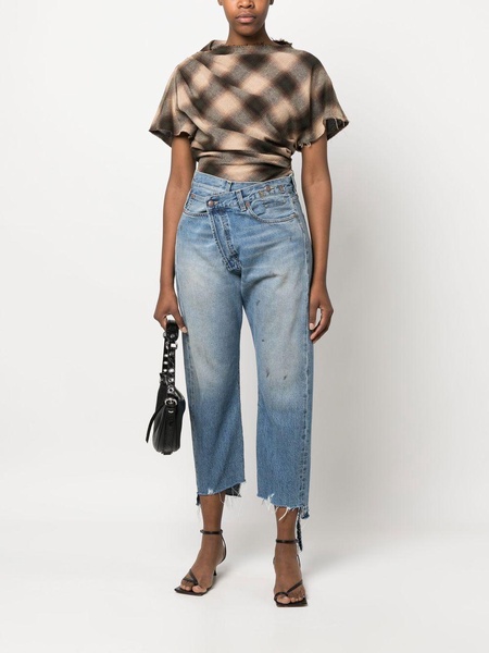 off-centre distressed denim trousers