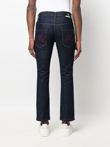 skull-embroidered skinny jeans