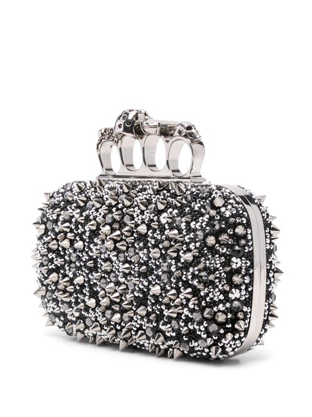 Knuckle embellished leather clutch