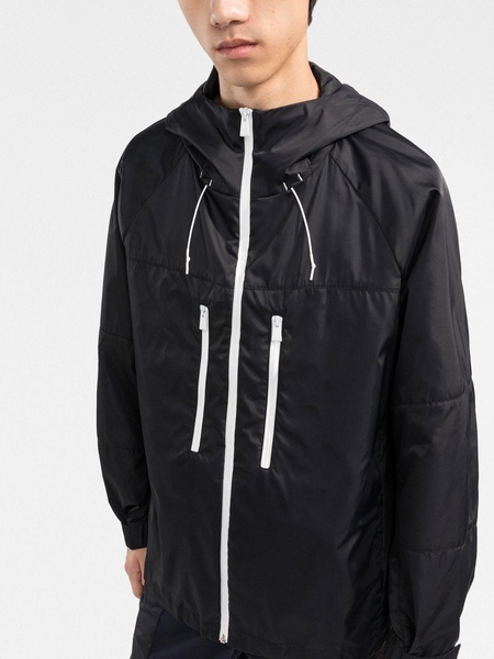 zipped-up hooded windbreaker