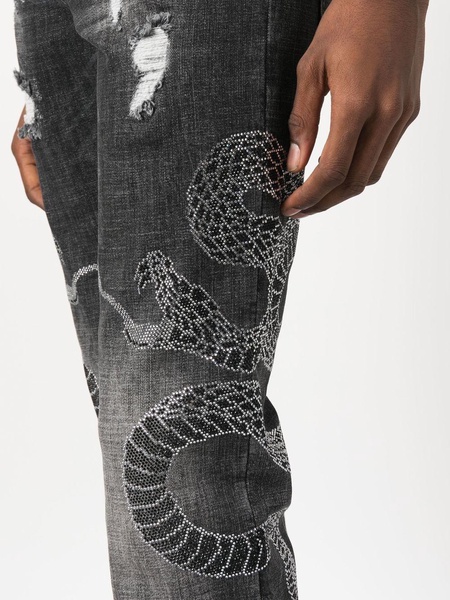 snake-motif ripped jeans