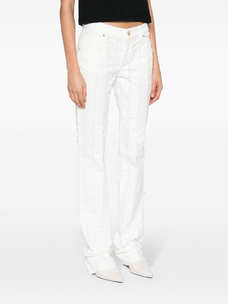 raw-cut detailed slim-leg trousers