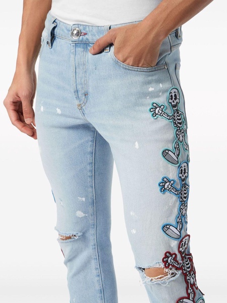 Skully Gang low-rise skinny jeans