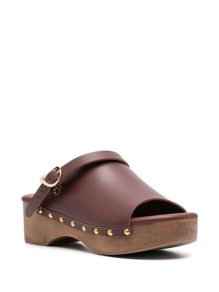 buckled leather clogs