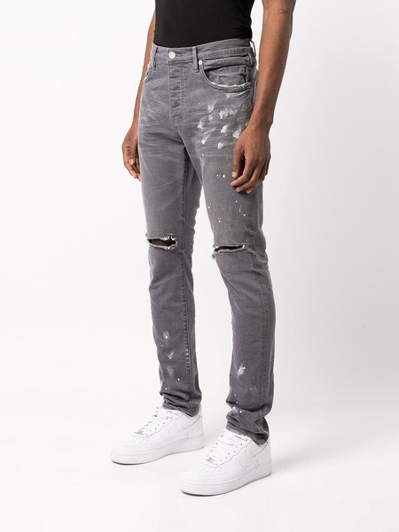 distressed paint-splatter slim fit jeans