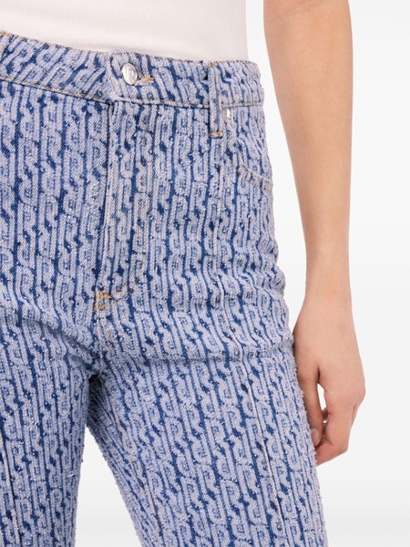 monogram-pattern flared jeans