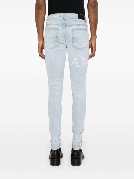 logo-embroidered cotton jeans